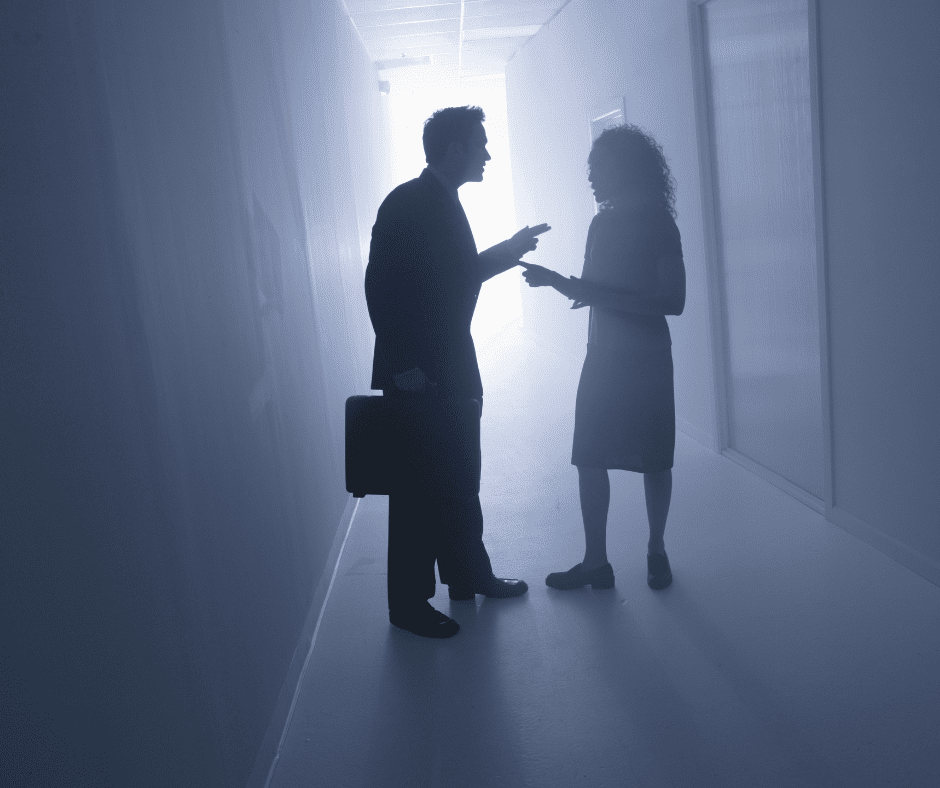 Couple arguing in halllway