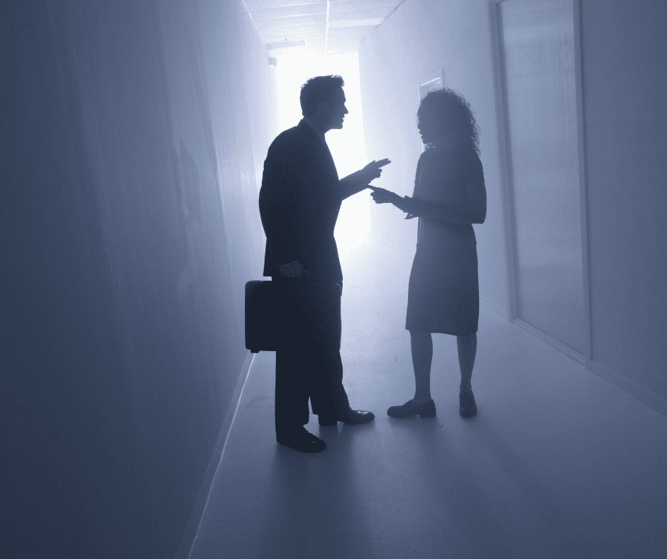 Couple arguing in halllway