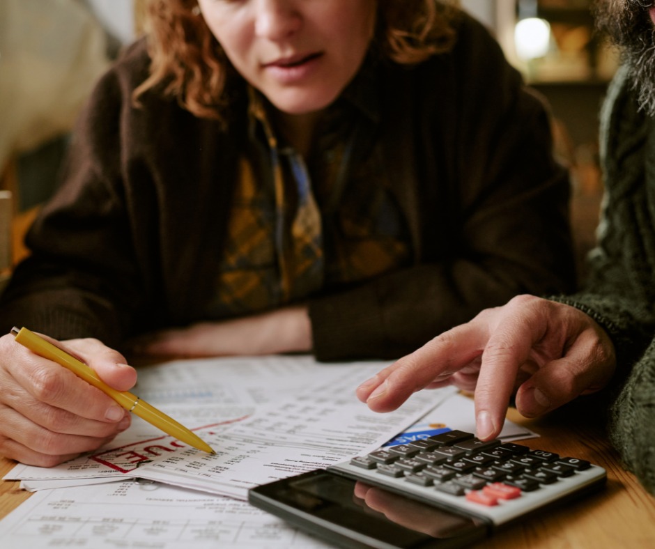 Couple reviewing financial documents, representing postnuptial agreements in Israel